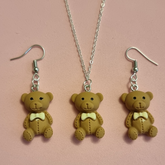Bear pendant with earrings.