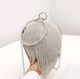 Rhinestone fringe decor clutch bag.
