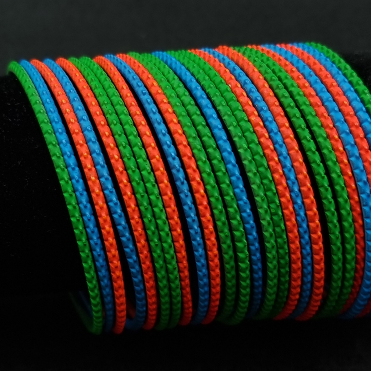 Multi coloured metal bangle set. Multi coloured metal bangle set.