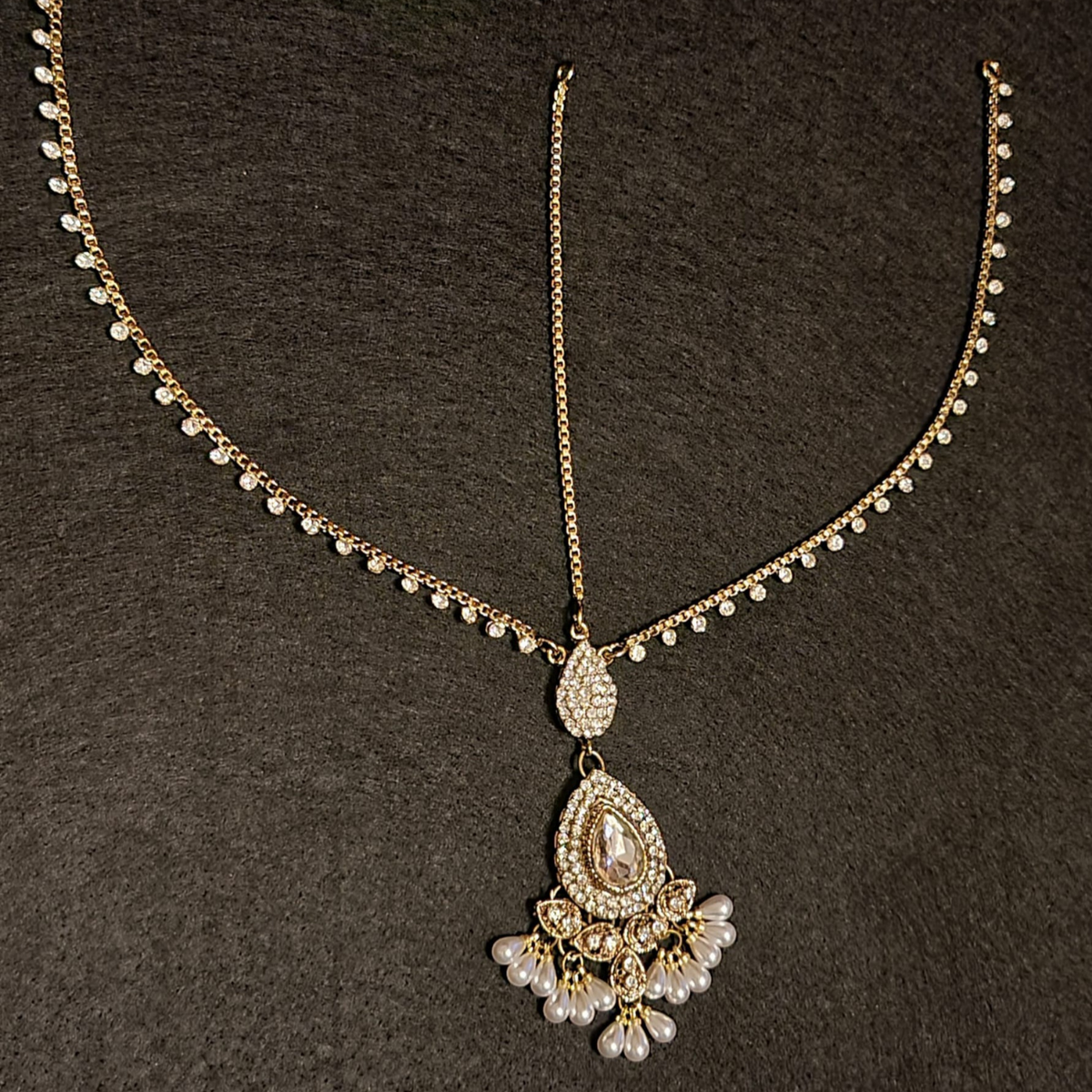 Beautiful indian traditional maang tikka with diamond cut stones and pearls