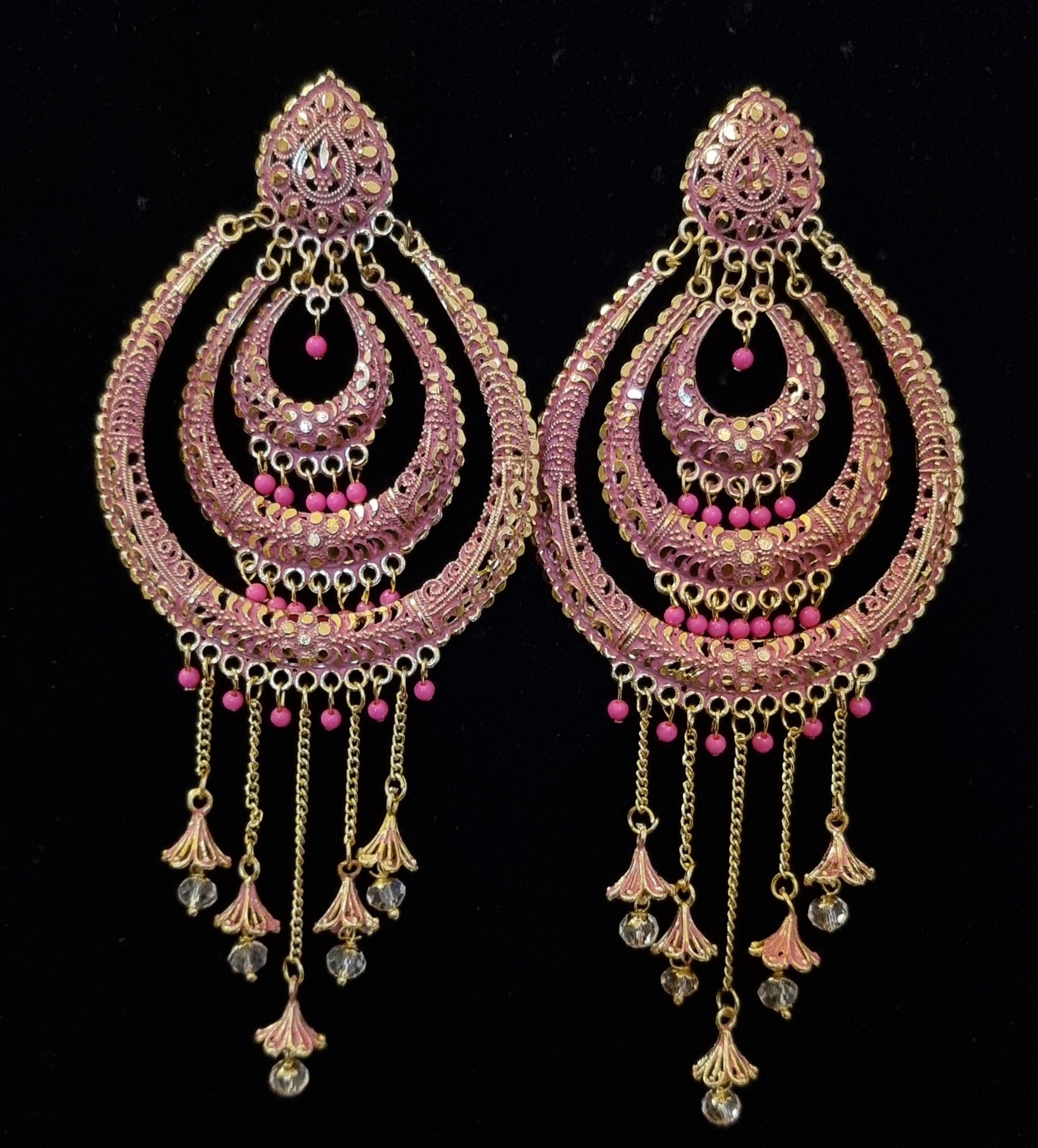 Long jhumka style earrings with tassels.