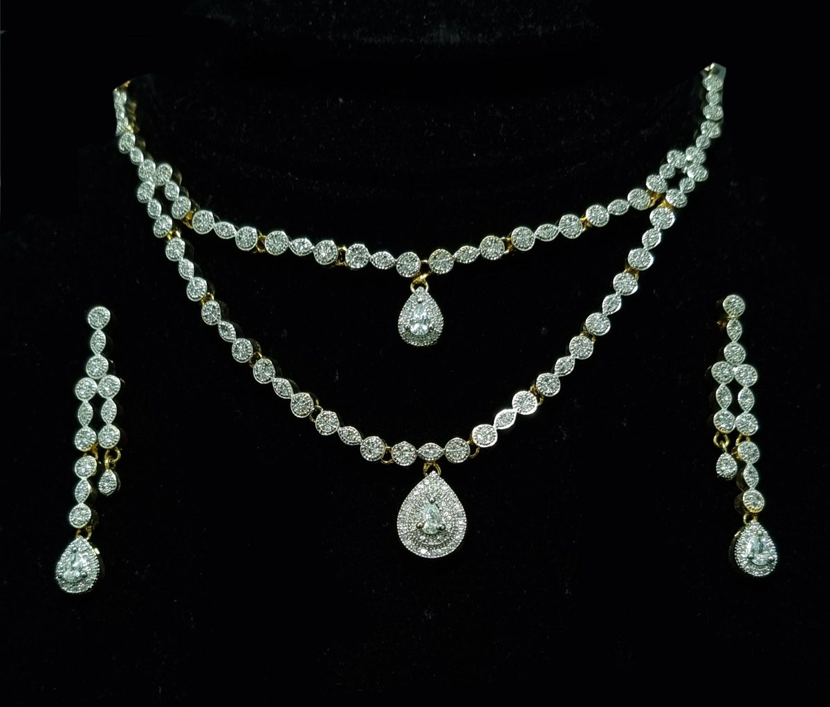 Silver 925 Gold-Plated Alluring Duo Layered Diamond- Like Stones Studded Necklace With A Tear Shaped Diamond-LIKE Necklace Earrings Set.