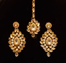 Load image into Gallery viewer, Designer stone studded kundan bridal set with earrings and mathapatti.