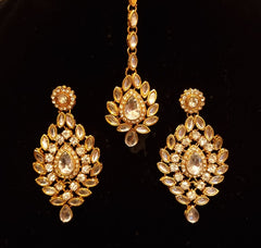 Designer stone studded kundan bridal set with earrings and mathapatti.