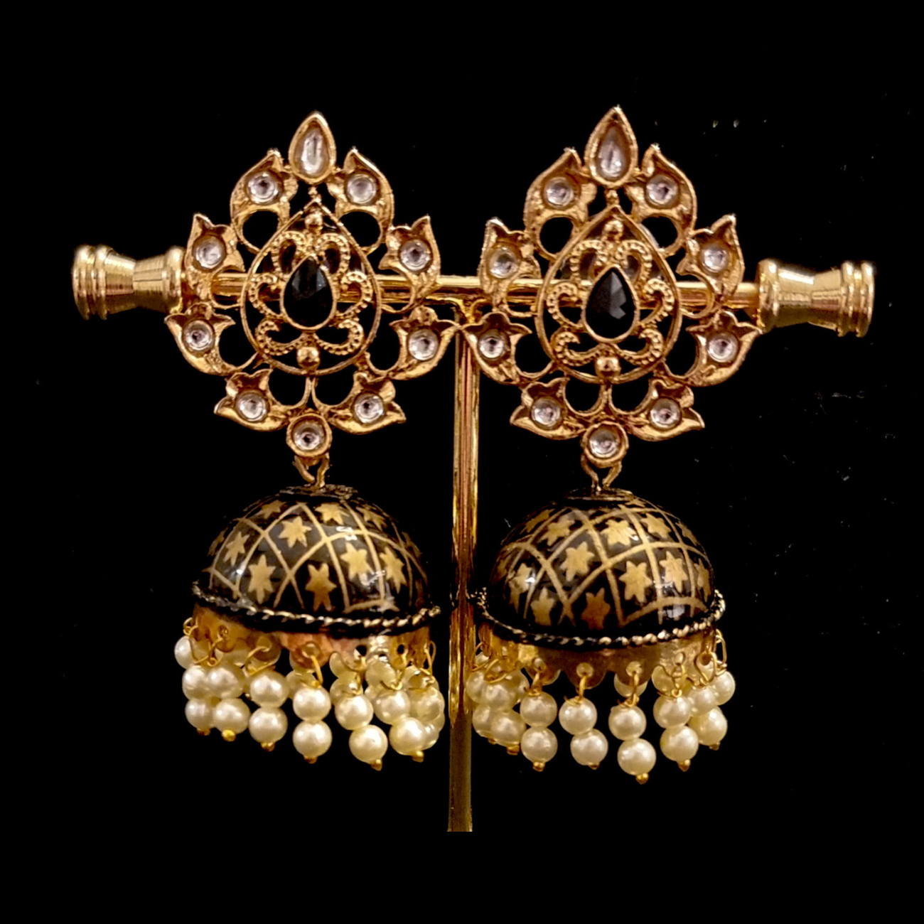 Hand crafted meenakari kundan jhumkas. Hand crafted meenakari kundan jhumkas.