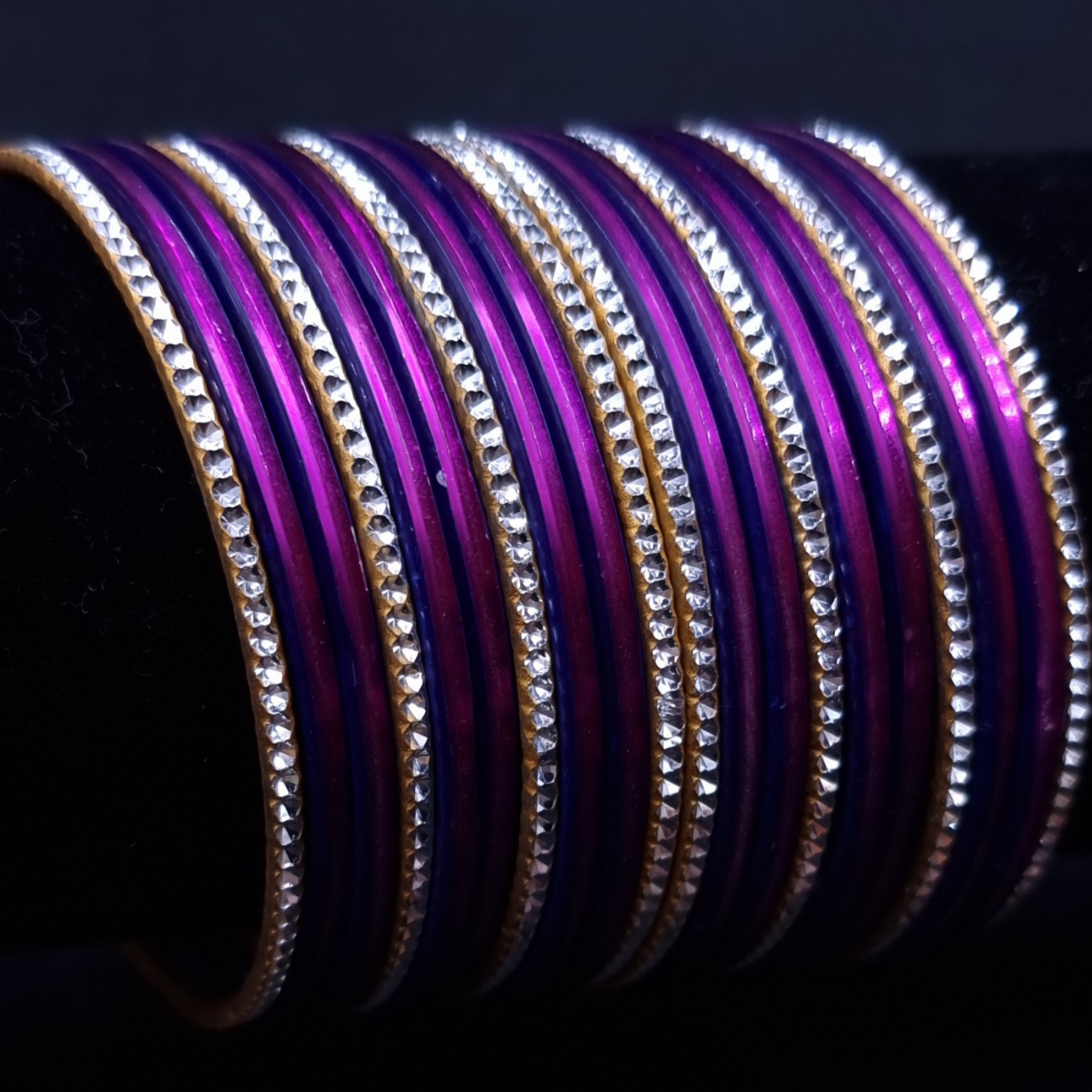 Purple with silvertone metal bangles. Purple with silvertone metal bangles.