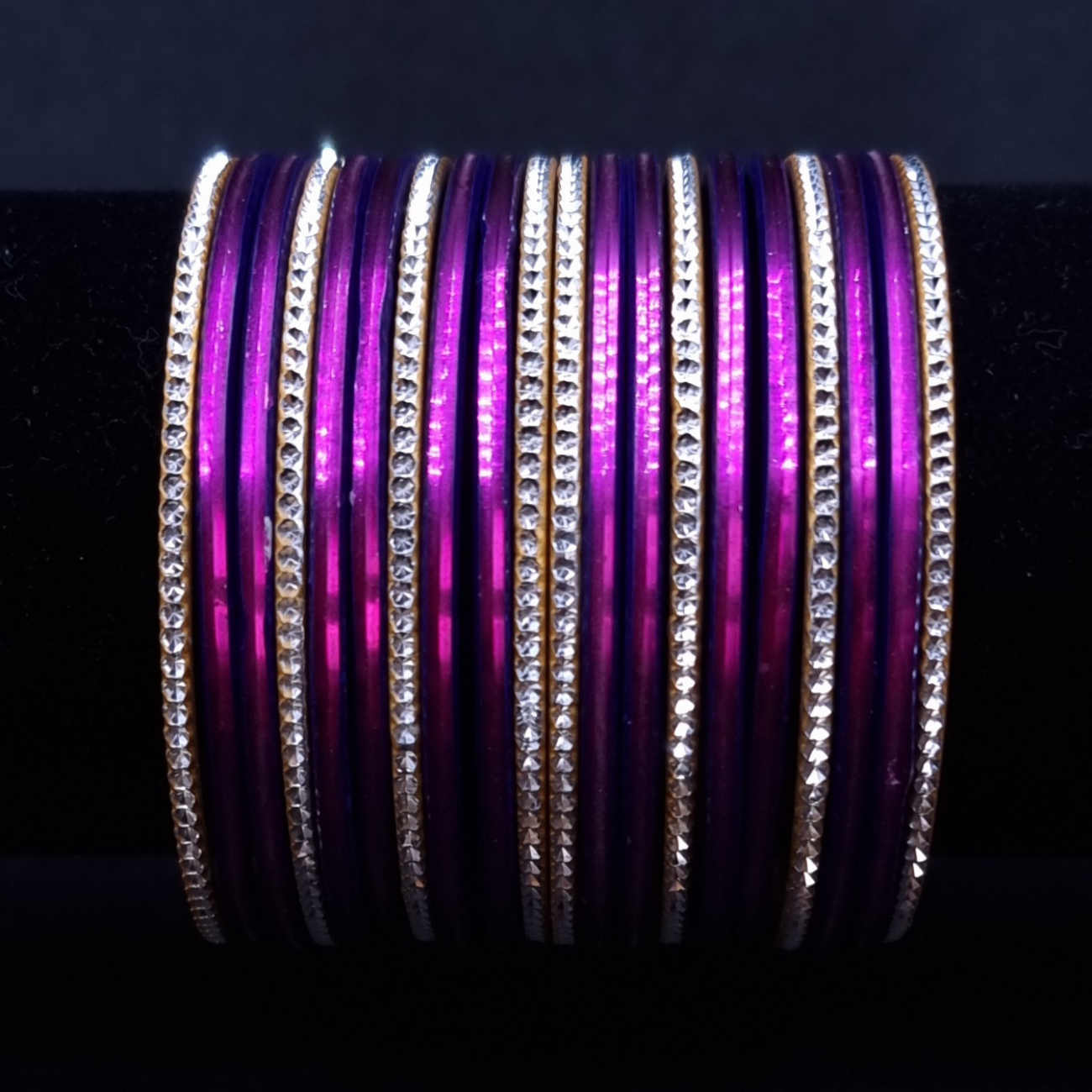 Purple with silvertone metal bangles. Purple with silvertone metal bangles.
