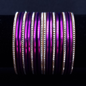 Purple with silvertone metal bangles.