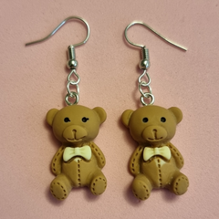 Bear pendant with earrings.