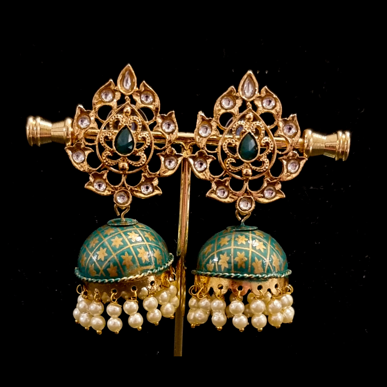 Hand crafted meenakari kundan jhumkas. Hand crafted meenakari kundan jhumkas.