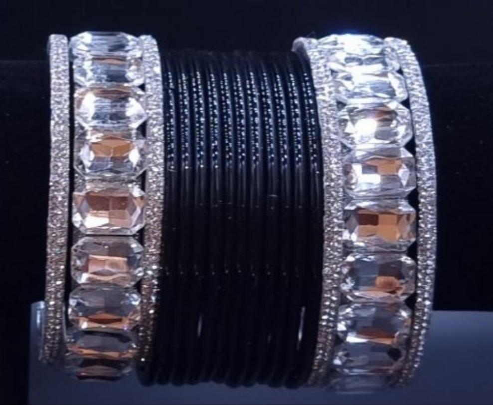 AD stones kadas with plain black glass bangles set. AD stones kadas with plain black glass bangles set.