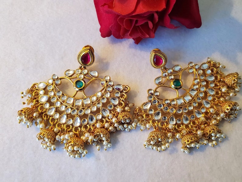 Gold plated chandbali with kundan and jhumkis. Gold plated chandbali with kundan and jhumkis.